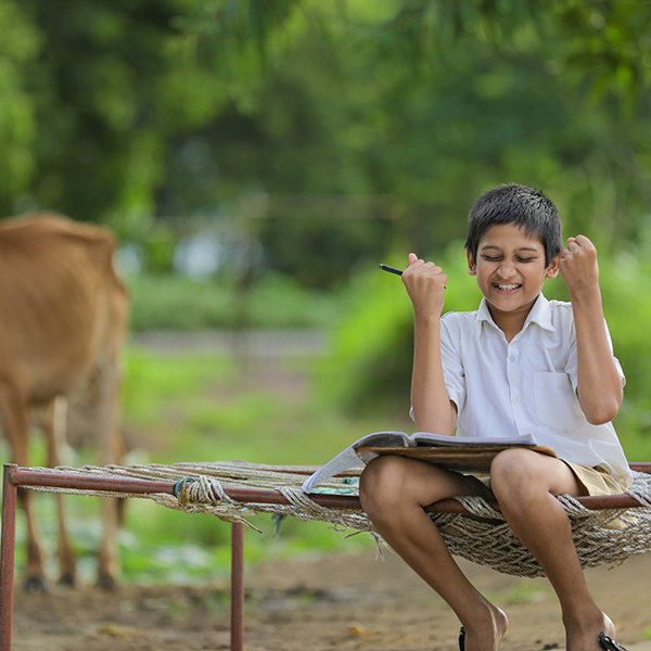 arjuns story indian boy with text books and cow